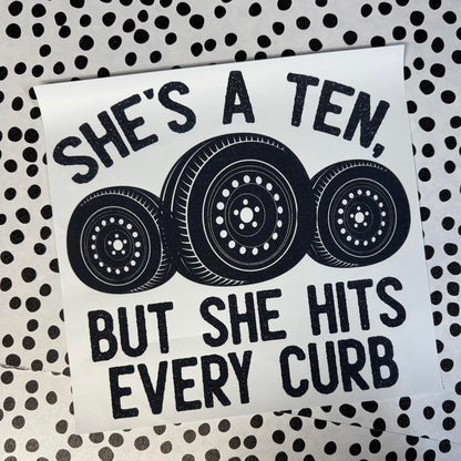 SHE’S A TEN BUT SHE HITS EVERY CURB